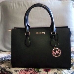 Brand New Medium size,black Michael Kor's satchel purse.